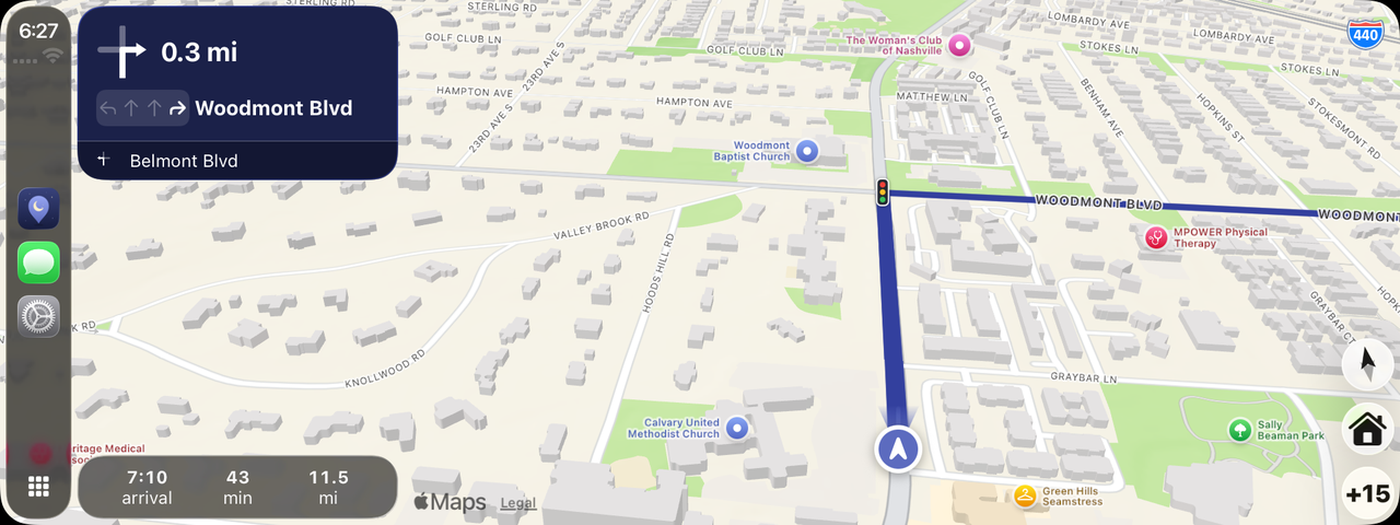 CarPlay on a wide dashboard screen during a calm loop from Green Hills, Nashville. The turn card reads turn right onto Woodmont Blvd in 0.3 miles, with the right-hand lane marked, then Belmont Blvd. The route and its traffic lights are on the map, arrival is at 7:10 with 43 minutes and 11.5 miles left, and the compass, Home and +15 buttons are at the right.