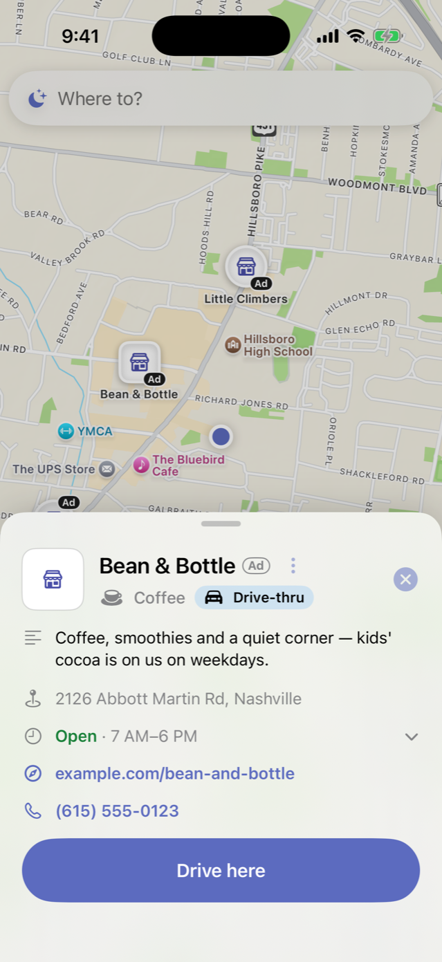 La fiche d'un partenaire fictif, Bean & Bottle, ouverte dans LullaRoute : le nom avec l'étiquette Ad, Coffee et Drive-thru, une description d'une ligne, l'adresse, les horaires du jour, le site et le numéro de téléphone, et un bouton Drive here. Capture de l'app en anglais.